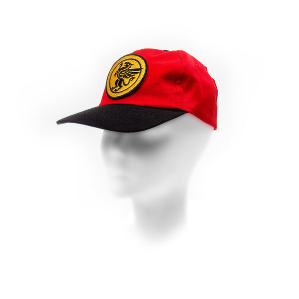 Red and black cap with a yellow emblem on a white background