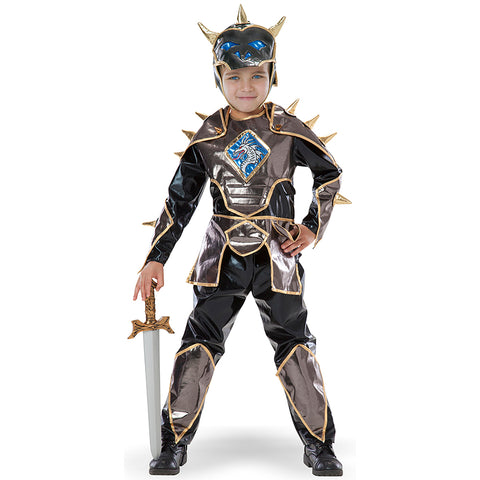 Little boy wearing a Knight costume made for kids dress up play with dragon emblem, helmet and sword.